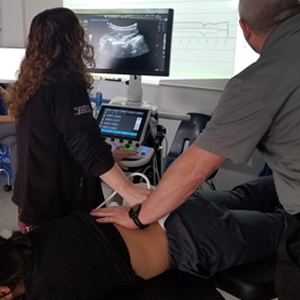 image Manahawkin chiropractic ultrasound imaging of spinal vertebrae during treatment